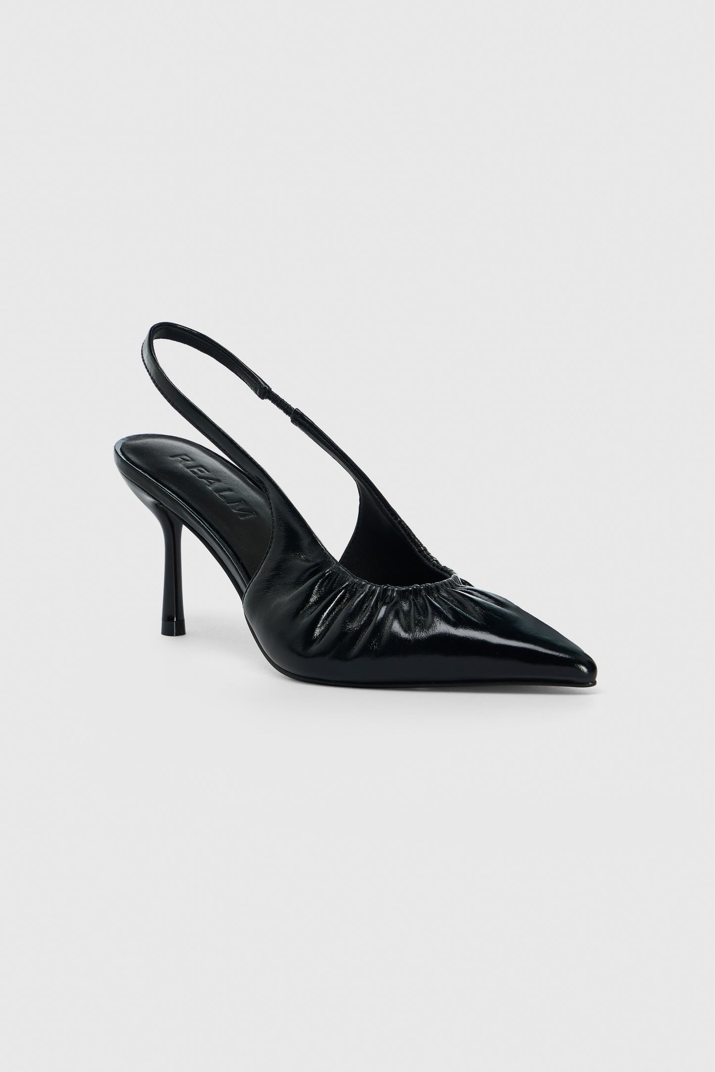 Black leather high heeled slingback shoes with pointed toe