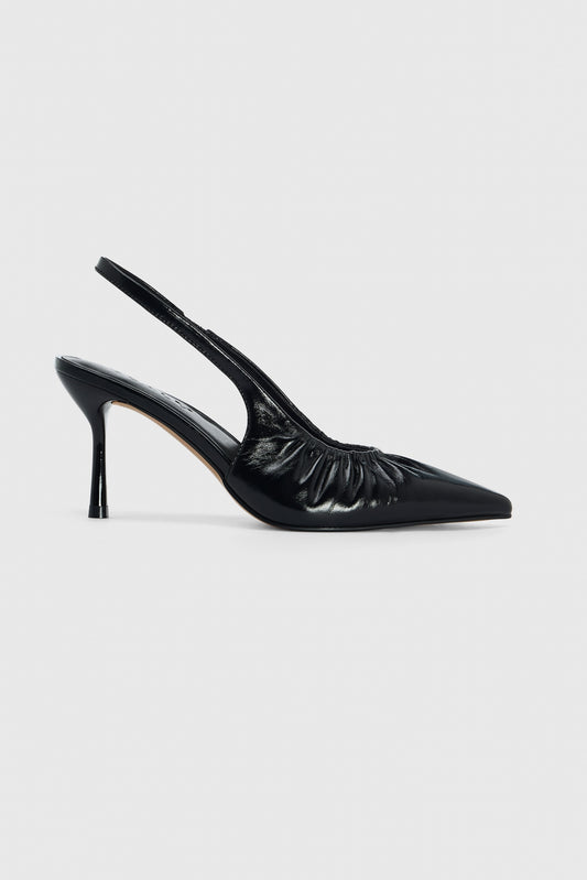 Black leather high heeled slingback shoes with pointed toe