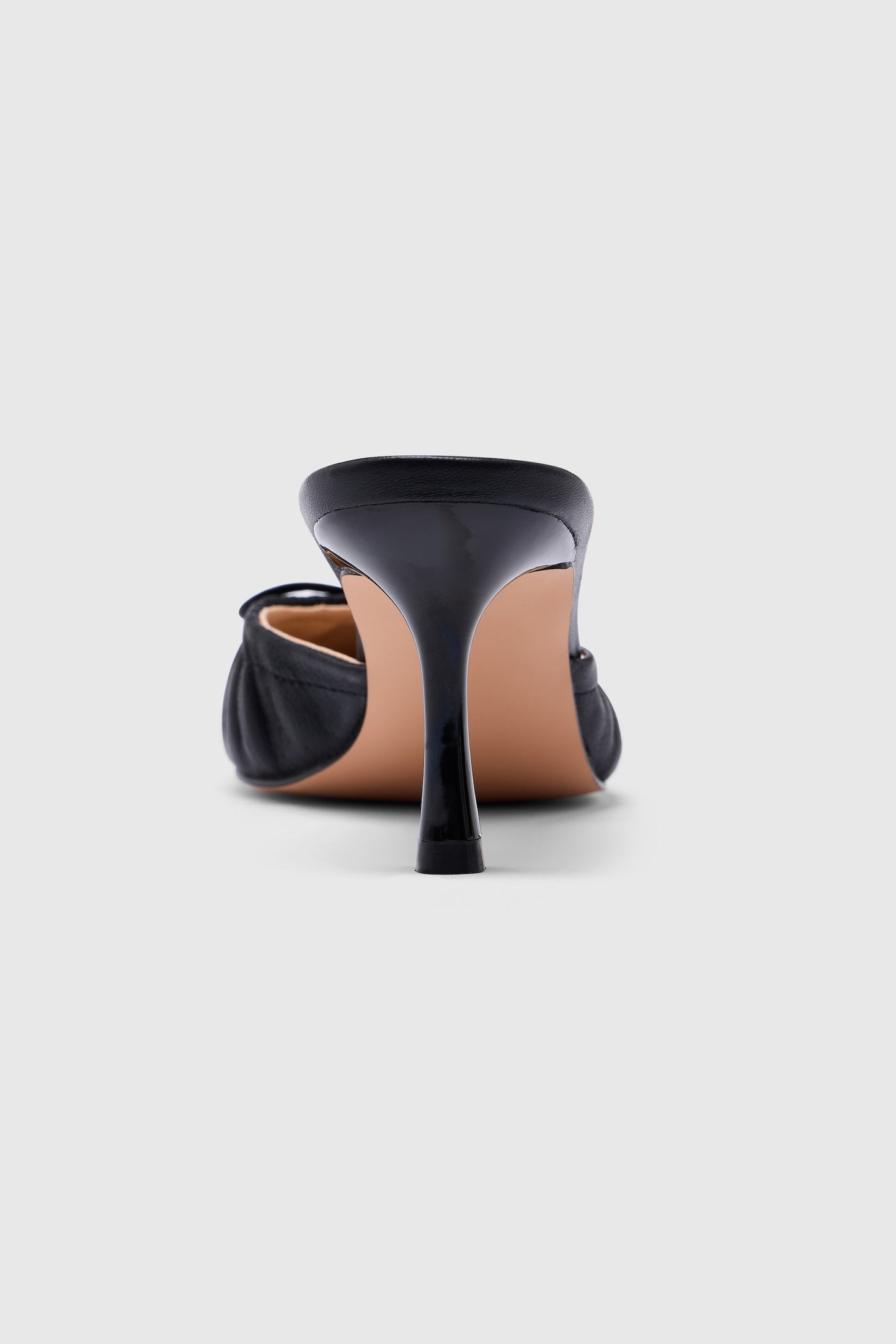 Black leather pointed-toe high-heeled backless court shoes
