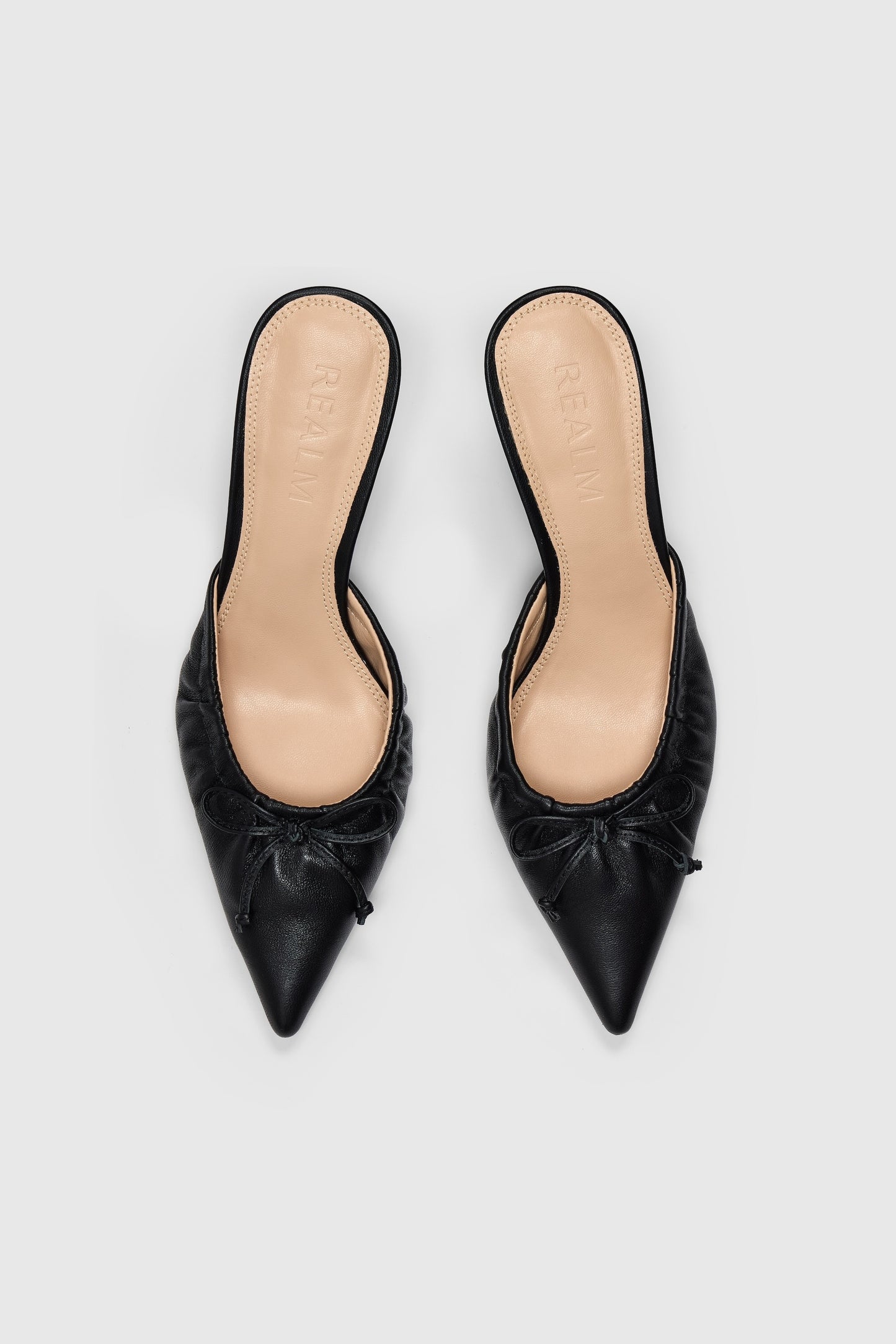 Black leather pointed-toe high-heeled backless court shoes