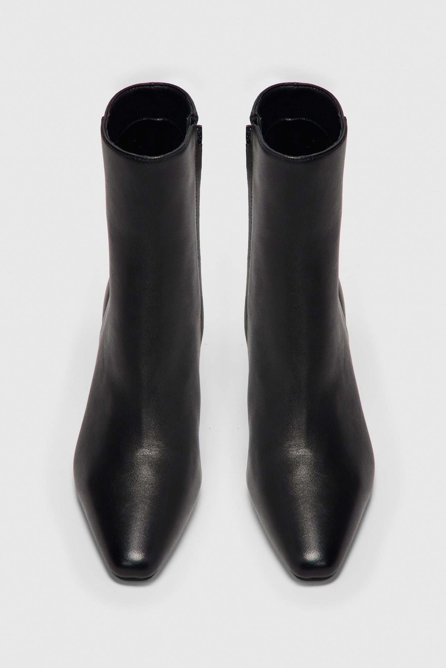 Black leather zip up ankle boots