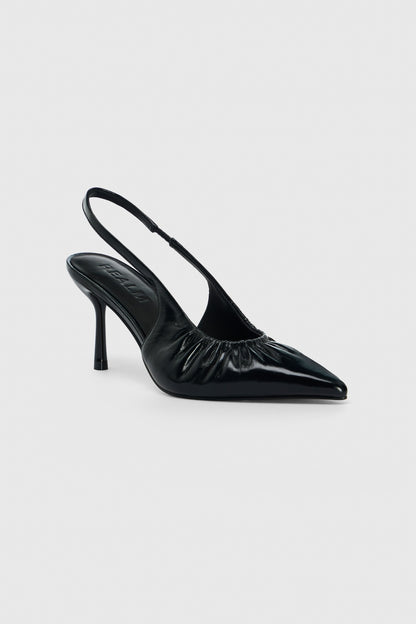 Black leather high heeled slingback shoes with pointed toe