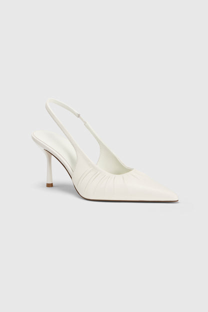 The Realm Cascade Slingbacks in white  leather feature a pointed toe, ruched side detailing, and a low stiletto heel—shown against a plain light background.