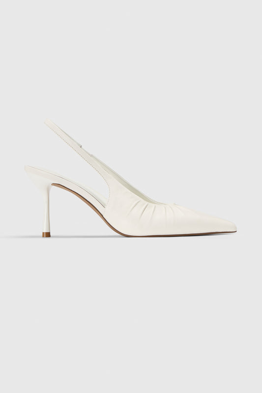 The Realm Cascade Slingbacks in black leather feature a gathered side detail and slim stiletto heel, shown against a plain light gray background.