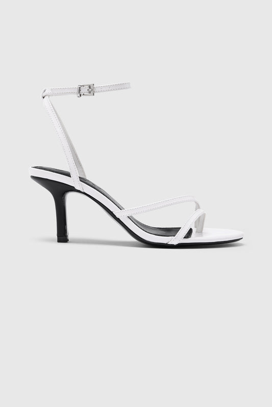 White leather asymmetric heeled sandals with an ankle strap