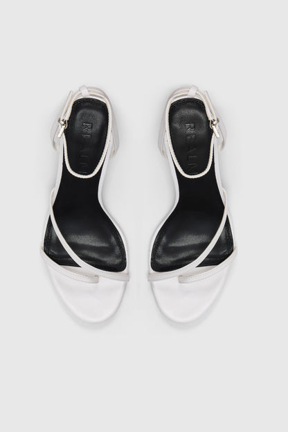 White leather asymmetric heeled sandals with an ankle strap