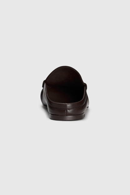 A rear view of the Realm Everyday Loafers in black leather, displayed against a plain light gray background.
